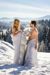 © zokov_111 - couple in blankets in winter against the background of mountains