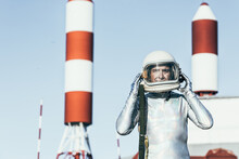 Cosmonaut Against Rocket Shaped Antennas