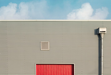 Fototapete - Industrial architecture. Close up of a warehous main entrance.
