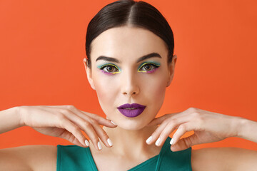 Poster - Beautiful young woman with stylish makeup on color background