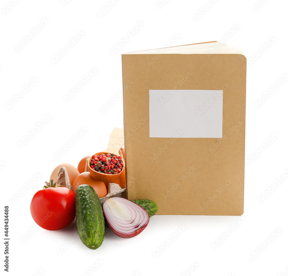 Recipe book with products on white background