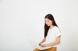 © 1981 Rustic Studio - woman with laptop computer sitting cross legged and looking