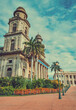Old cathedral of managua with blue sky, close up of an old cathedral next to lanterns around