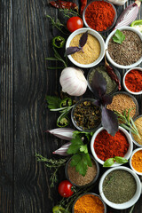 Wall Mural - Concept of aromatic spices on rustic wooden table