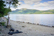 Swimming Towel And Wet Suit On The Shore Of Culag Beach On Loch Lomond