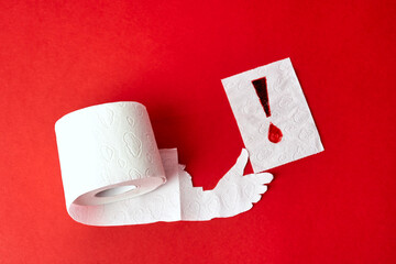 Fototapeta roll of toilet paper with hand holding sheet with bloody exclamation mark