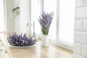 Wall Mural - A bouquet of lavender in the interior of a stylish kitchen.