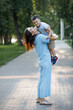 © olgasparrow - Mom with her son on hands in the summer park.