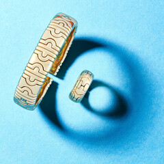 Sticker - High angle shot of a luxury bracelet and ring on a blue background