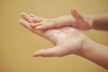 Close up of a hand using hand sanitizer.