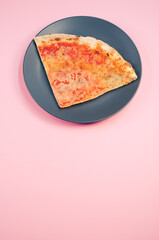 Wall Mural - Plate with a slice of pizza isolated on a pink background- free space for text