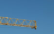 Crane steel cantilever ending on blue sky background