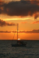 Wall Mural - boat at sunset on water in fiji