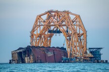 Capsized Cargo Ship Being Disassembled