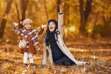 Wall Mural - Cute and stylish family in a autumn park