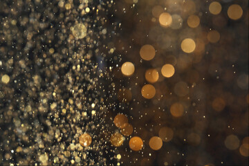 Wall Mural - blurred view of golden lights on black background. bokeh effect