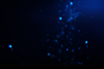 Wall Mural - blurred view of festive lights on blue background. bokeh effect