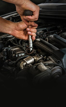 Auto Mechanic Working On Car Engine In Mechanics Garage. Repair Service. Close-up Shot. Free Space For Text, Copy Space