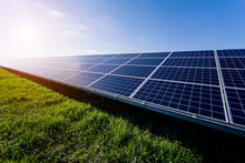 Photovoltaic Solar Panels On Blue Sky Background