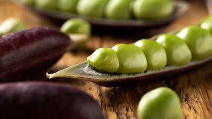 Wall Mural - Sweet purple Magnolia Pea, Sugarsnap on rustic wooden board. ready to eat