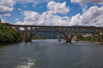 Wall Mural - Concrete and Stone Bridges - View from the Cruise Boat in Douro River Valley - Port Wine Region with Farms Terraces Carved in Mountains - Peso da Régua, Portugal