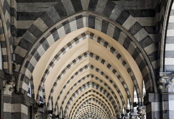 Sticker - Detail of the arcade in Gothic style in Via XX Settembre, one of the main street of Genoa, with black and white marble bands, Liguria, Italy