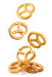 A pretzel falling on a white background, a pretzel levitating. Isolated