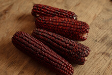 Jimmy Red Corn On Wooden Background
