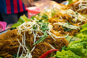 Wall Mural - Street food market in Asia. Noodle stall