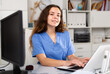 © JackF - European woman therapist working with case histories at her workplace on laptop in medical center