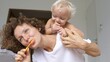 © Sia - White toddler Learning how to enjoy brushing teeth with mom. Oral hygiene for babies