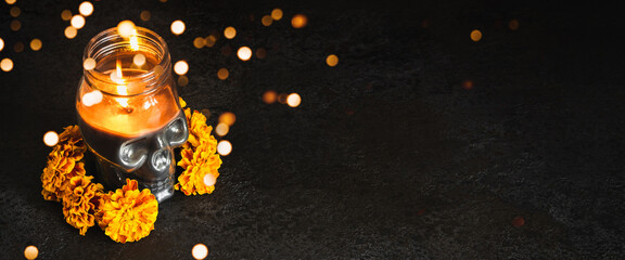 skull with marigold flowers wreath and bokeh lights on black banner. dia de los muertos day or day o