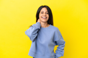 Poster - Young caucasian woman isolated on yellow background laughing