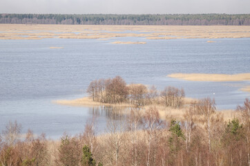 Wall Mural - Aerial view of Kanieris lake in sunny spring day, Latvia
