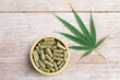 © NIKCOA - Cannabis powder medicine capsule isolated