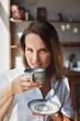 © ksenija1803z - portrait of woman with mug of coffee in her hands