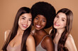 © Beauty Hero - Photo of shiny charming three girlfriends wear crop tops smiling hugging isolated beige color background