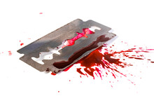 Razor Blade Wit Blood Splash And Blood Drops, Isolated On White, Selective Focus Macro. Suicide Concept