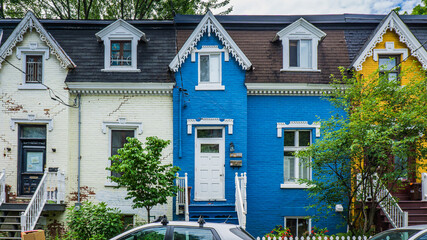 Wall Mural - Colorful brick facades and typical Montreal architecture of houses located on Drolet street, in Plateau Mont Royal neighborhood