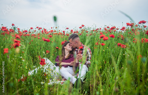 stay with me. summer flower meadow. romantic couple among poppies.