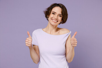 Poster - Young cheerful smiling happy stylish brunette woman 20s with bob haircut wear white t-shirt show thumbs up like gesture isolated on pastel purple background studio portrait People lifestyle concept