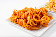 A View Of A Plate Of Curly Fries.
