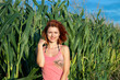 © Roman - beautiful girl with red hair in a cornfield