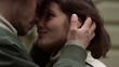 © stockbusters - Love couple enjoying date outdoor. Man touching woman face on urban street.