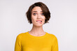Photo of nervous scared frightened girl look camera bite lips wear yellow shirt isolated grey color background