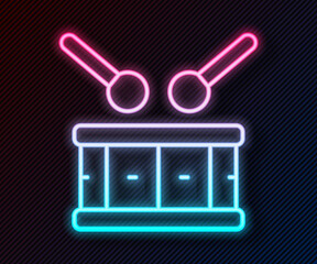 Glowing neon line Drum with drum sticks icon isolated on black background. Music sign. Musical instrument symbol. Vector