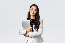 Business, Finance And Employment, Female Successful Entrepreneurs Concept. Young Asian Businesswoman, Bank Clerk In Glasses Holding Laptop And Looking Camera