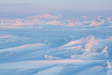 Wall Mural - winter arctic landscape. cold frosty winter weather. harsh polar climate. ice hummocks on the frozen