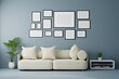 Group of the picture frame on the wall in the modern living room with sofa and furniture. 3d rendering.