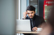 © eakgrungenerd - businessman thinking using laptop in cafe. professional online working in break time. businessperson concept.